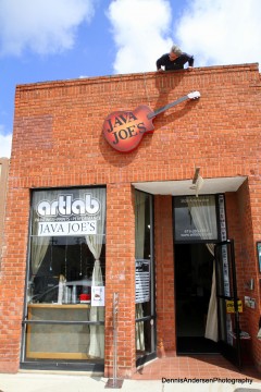 Owen Burke mounts the new Java Joe's sign