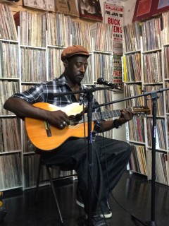 Freeman performing at Folk Arts Rare Records. Photo by Liz Abbott.